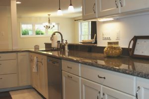 Peninsula open to family room, granite counters, hardwood floors 